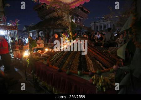 (150918) -- KATHMANDU, Sept. 17, 2015 -- Hindu devotees prepare samay dwan (a heap of beaten rice and other ingredients) to offer prayers during Ganesh Chaturthi festival at the Ganesh Temple in Kathmandu, Nepal, Sept. 17, 2015. The festival marks the birthday of Lord Ganesha who is widely worshiped by Hindus as the god of wisdom, prosperity and good fortune. ) NEPAL-KATHMANDU-GANESH CHATURTHI FESTIVAL SunilxSharma PUBLICATIONxNOTxINxCHN   Kathmandu Sept 17 2015 Hindu devotees prepare Samay Dwan a Heap of Beaten Rice and Other Ingredients to OFFER Prayers during Ganesh Chaturthi Festival AT Th Stock Photo
