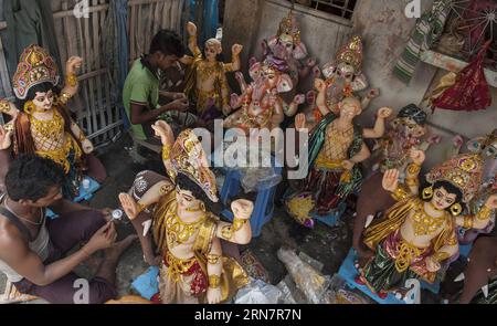 (150918) -- KOLKATA, Sept. 17, 2015 -- Indian artists work on the idols of god Bishwakarma on the eve of Bishwakarma worship festival at Kumartuli in Kolkata, Capital of eastern Indian state West Bengal, Sept. 17, 2015. According to Hindu mythology, Biswakarma is the God of Architecture and engineering, and the festival is celebrated in September by artists, craftsmen, and weavers. )(azp) INDIA-KOLKATA-BISWAKARMA FESTIVAL TumpaxMondal PUBLICATIONxNOTxINxCHN   Kolkata Sept 17 2015 Indian Artists Work ON The IDOLS of God  ON The Eve of  Worship Festival AT Kumartuli in Kolkata Capital of Eastern Stock Photo