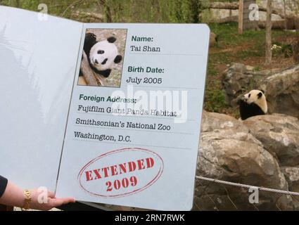 (150919) -- BEIJING, Sept. 19, 2015 -- A worker presents the panda passport for giant panda cub Tai Shan at the Fujifilm Giant Panda Habitat at the Smithsonian s National Zoo in Washington, the United States, April 24, 2007. Tai Shan s stay in the zoo is expanded to July of 2009, announced by Chinese ambassador to the United States Zhou Wenzhong in a ceremony held in the zoo. Always with their sleepy dark circles, always detached, the chubby bear-like animal are probably the coolest diplomats in the history of China-U.S. relationship. Since Pandora, the first ever giant panda officially introd Stock Photo