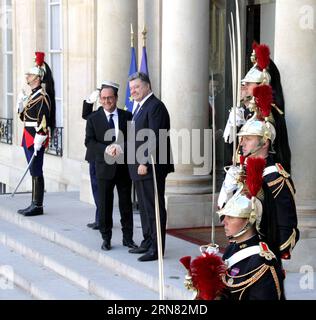 French President Francois Hollande, center, waves as he watches a ...