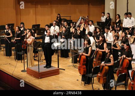 Musicians participate in a charity concert in Singapore, Oct. 4, 2015. Organized by Business School, National University of Singapore (NUS) and Chinese Music Academy in Singapore, a charity concert bringing the masterpiece Butterfly Lovers Concerto was held here on Sunday to raise money for financially-needy students to further their educational pursuits. Meanwhile, the concert also celebrated Singapore s golden jubilee as well as the 25th anniversary of China-Singapore diplomatic relations. ) SINGAPORE-CHARITY CONCERT BaoxXuelin PUBLICATIONxNOTxINxCHN   Musicians participate in a Charity Conc Stock Photo