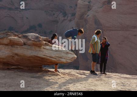 Visitors  at Tsegi Overlook on the South Rim drive of Canyon De Chelly National Monument - Navajo Indian Reservation, Arizona Stock Photo