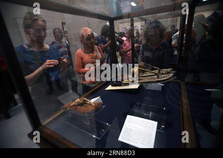 (151011) -- CAIRO, Oct. 11, 2015 -- Visitors look at exhibits on an exhibition about footwears in ancient Egypt at the Egyptian Museum in Cairo, Egypt, on Oct. 11, 2015. An exhibition called Stepping Through Time held by Egypt s Ministry of Antiquities was open to the public on Sunday, presenting around 50 objects through different ages. ) EGYPT-CAIRO-CULTURE-FOOTWEAR-EXHIBITION AhmedxGomaa PUBLICATIONxNOTxINxCHN   151011 Cairo OCT 11 2015 Visitors Look AT Exhibits ON to Exhibition About  in Ancient Egypt AT The Egyptian Museum in Cairo Egypt ON OCT 11 2015 to Exhibition called stepping Throug Stock Photo