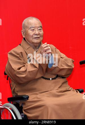 (151012) -- NANJING, Oct. 12, 2015 -- Master Hsing Yun, founder of the influential Fo Guang Shan Monastery in southeast China s Taiwan, greets attendees during the launching ceremony of an academy built for Chinese art research in a campus of Nanjing University in Nanjing, capital of east China s Jiangsu Province, Oct. 12, 2015. The academy building is named after Hsing Yun for his devotion in 2010 to the project. Located inside the building, the Li Chimao Art Museum was officially opened on Monday. ) (yxb) CHINA-NANJING-NEW COLLEGE BUILDING (CN) SunxCan PUBLICATIONxNOTxINxCHN   151012 Nanjing Stock Photo