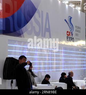 (151013) -- HARBIN, Oct. 13, 2015 -- A Chinese visitor takes photos at the booth of Russia during the second China-Russia Exposition in Harbin, northeast China s Heilongjiang Province, Oct. 13, 2015. Nearly 10,000 businessmen from 103 countries and regions attended the expo. The event will last till Oct. 16, 2015.) (zhs) CHINA-HARBIN-RUSSIA-EXPO (CN) WangxSong PUBLICATIONxNOTxINxCHN   Harbin OCT 13 2015 a Chinese Visitor Takes Photos AT The Booth of Russia during The Second China Russia Exposure in Harbin Northeast China S Heilongjiang Province OCT 13 2015 parishioners 10 000 businessmen from Stock Photo