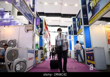 (151016) -- GUANGZHOU, Oct. 16, 2015 -- A visitor is seen at the Thailand booth during the China Import and Export Fair, or the Canton Fair, in Guangzhou, capital of south China s Guangdong Province, Oct. 16, 2015. A total of 353 enterprises from countries and regions along the Belt and Road participated the current Canton Fair held in Guangzhou, which took nearly 60 percent of all exhibitors. The Belt and Road initiative, standing for the Silk Road Economic Belt and the 21st Century Maritime Silk Road, was unveiled by Chinese President Xi Jinping in 2013. It brings together countries in Asia, Stock Photo