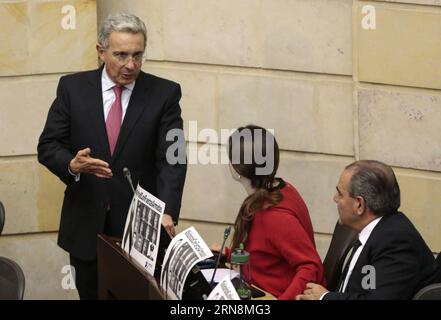 (151029) -- BOGOTA, Oct. 29, 2015 -- Senator and Former Colombian President Alvaro Uribe (L) attends the Colombia s Senate Plenary Session in Bogota, capital of Colombia, Oct. 29, 2015. The Prenary Session of the Senate cotinued Thursday the discussion of the constitutional reform that was needed to implement the peace agreements with the Armed Revolutionary Forces of Colombia (FARC), according with local press information. Juan Paez/COLPRENSA) (jg) (ah) MANDATORY CREDIT NO FILE-NO SALES EDITORIAL USE ONLY COLOMBIA OUT COLOMBIA-BOGOTA-FARC-POLITICS-SENATE e COLPRENSA PUBLICATIONxNOTxINxCHN   B Stock Photo