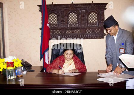 (151030) -- KATHMANDU,  - Nepal s newly elected President Bidhya Devi Bhandari (L) signs documents and assumes her post in Kathmandu, Nepal, Oct. 29, 2015. Newly-elected President Bidhya Devi Bhandari was sworn in on Thursday as the first female president of Nepal. )(azp) NEPAL-KATHMANDU-FORMER PRESIDENT-FAREWELL PratapxThapa PUBLICATIONxNOTxINxCHN   Kathmandu Nepal S newly Elected President  Devi Bhandari l Signs Documents and assumes her Post in Kathmandu Nepal OCT 29 2015 newly Elected President  Devi Bhandari what sworn in ON Thursday As The First Female President of Nepal EGP Nepal Kathma Stock Photo