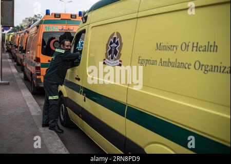 (151101) -- CAIRO, Nov. 1, 2015 -- An Egyptian ambulance worker rests by ambulances lining up outside the Zenhoum Morgue of Cairo where bodies of plane crash victims are stored, Cairo, Egypt, on Nov. 1, 2015. A total of 162 bodies of victims in the crash of Russian passenger airplane are to be airlifted later Sunday back to Russia, according to Egypt s state news agency MENA. ) EGYPT-CAIRO-RUSSIA-PLANE CRASH-MORGUE-BODIES-TRANSFERING PanxChaoyue PUBLICATIONxNOTxINxCHN   Cairo Nov 1 2015 to Egyptian Ambulance Worker rests by ambulances Lining up outside The  morgue of Cairo Where Bodies of Plan Stock Photo