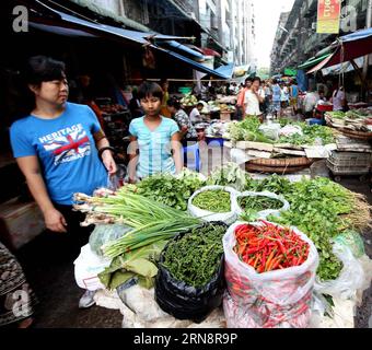 (151103) -- YANGON, Nov. 3, 2015 -- People visit a vegetable market in Yangon, Myanmar, Nov. 3, 2015.) MYANMAR-YANGON-DAILY LIFE UxAung PUBLICATIONxNOTxINxCHN   Yangon Nov 3 2015 Celebrities Visit a Vegetable Market in Yangon Myanmar Nov 3 2015 Myanmar Yangon Daily Life UxAung PUBLICATIONxNOTxINxCHN Stock Photo