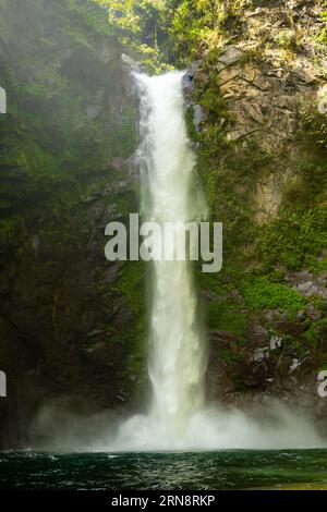 Tappiyah tropical waterfall in Batad, Philippines, vertical image with copy space for text Stock Photo