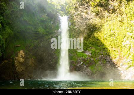 Waterfall at mountain Gorge in Batad, province Banaue. North Philippines. Horizontal image with copy space for text Stock Photo