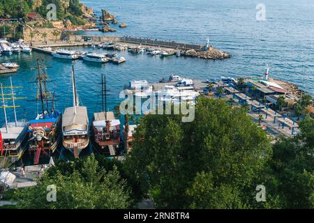 14.06.2023, Antalya, Turkey. Top view of Antalya city and harbour with moored ships. Panoramic view of old harbor and downtown called Marina in Antaly Stock Photo