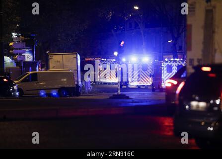 Ambulances are seen at a square near the Bataclan concert hall in Paris Nov. 14, 2015. Over 100 people were killed in a mass hostage-taking at the Bataclan concert hall Friday and many more were feared dead in a series of bombings and shootings. ) FRANCE-PARIS-ATTACK-BATACLAN CONCERT HALL ZhouxLei PUBLICATIONxNOTxINxCHN Stock Photo