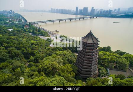 HANGZHOU,  Aerial photo taken on Sept. 17, 2015 shows the Liuhe Pagoda near the Qiantang River Bridge in Hangzhou, capital of east China s Zhejiang Province. China will host the 2015 Group of Twenty (G20) summit in the eastern city of Hangzhou, best known for its scenic West Lake,  Chinese President Xi Jinping announced in Antalya, Turkey  (wf) CHINA-HANGZHOU-CITY VIEW (CN) XuxYu PUBLICATIONxNOTxINxCHN   Hangzhou Aerial Photo Taken ON Sept 17 2015 Shows The Liuhe Pagoda Near The Qiantang River Bridge in Hangzhou Capital of East China S Zhejiang Province China will Host The 2015 Group of Twenty Stock Photo