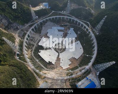 Bau des weltgrößten Radioteleskops in China  --  China s single-aperture spherical telescope FAST is seen under construction in Qiannan of southwest China s Guizhou Province, Nov. 21, 2015. When it is completed in 2016, the five hundred meter aperture spherical telescope (FAST) will be the world s largest, overtaking Puerto Rico s Arecibo Observatory, which is 300 meters in diameter. ) (zhs) CHINA-GUIZHOU-FAST-TELESCOPE (CN) JinxLiwang PUBLICATIONxNOTxINxCHN   Construction the world Radio telescope in China China S Single Aperture spherical Telescope Almost IS Lakes Under Construction in Qiann Stock Photo