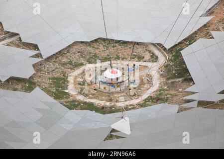 Bau des weltgrößten Radioteleskops in China  --  China s single-aperture spherical telescope FAST is seen under construction in Qiannan of southwest China s Guizhou Province, Nov. 21, 2015. When it is completed in 2016, the five hundred meter aperture spherical telescope (FAST) will be the world s largest, overtaking Puerto Rico s Arecibo Observatory, which is 300 meters in diameter. ) (zhs) CHINA-GUIZHOU-FAST-TELESCOPE (CN) JinxLiwang PUBLICATIONxNOTxINxCHN   Construction the world Radio telescope in China China S Single Aperture spherical Telescope Almost IS Lakes Under Construction in Qiann Stock Photo
