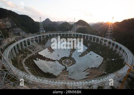 Bau des weltgrößten Radioteleskops in China  --  China s single-aperture spherical telescope FAST is seen under construction in Qiannan of southwest China s Guizhou Province, Nov. 21, 2015. When it is completed in 2016, the five hundred meter aperture spherical telescope FAST will be the world s largest, overtaking Puerto Rico s Arecibo Observatory, which is 300 meters in diameter.  zhs CHINA-GUIZHOU-FAST-TELESCOPE CN JinxLiwang PUBLICATIONxNOTxINxCHN Stock Photo