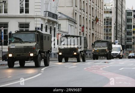 Terrorwarnung in Brüssel: Sicherheitskräfte auf den Straßen (151121)-- BRUSSELS, Nov. 21, 2015 -- Military vehicles are seen running through Brussels, capital of Belgium, on Nov. 21, 2015. The terror threat level in the Brussels region was increased to maximum on Saturday because authorities received information on the risk of an attack similar to Paris, Belgian Prime Minister Charles Michel told a press conference. ) BELGIUM-BRUSSELS-TERRORIST THREAT ALERT-HIGHEST ZhouxLei PUBLICATIONxNOTxINxCHN   Terror warning in Brussels Security forces on the Roads 151121 Brussels Nov 21 2015 Military VEH Stock Photo