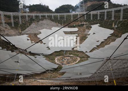 Bau des weltgrößten Radioteleskops in China (151121) -- PINGTANG, Nov. 21, 2015 -- The feed cabin supporting system of China s single-aperture spherical telescope FAST is under test in Qiannan of southwest China s Guizhou Province, Nov. 21, 2015. When it is completed in 2016, the five hundred meter aperture spherical telescope (FAST) will be the world s largest, overtaking Puerto Rico s Arecibo Observatory, which is 300 meters in diameter. ) (zhs) CHINA-GUIZHOU-FAST-TELESCOPE (CN) JinxLiwang PUBLICATIONxNOTxINxCHN   Construction the world Radio telescope in China 151121 Ping Tang Nov 21 2015 T Stock Photo