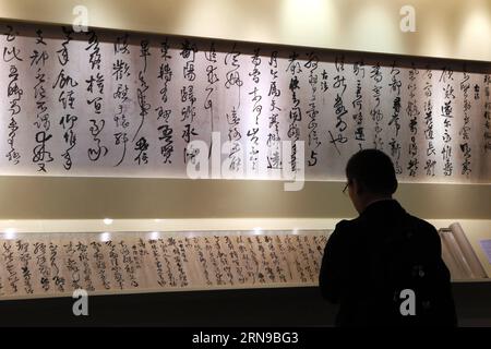 (151127) -- HONG KONG, Nov. 27, 2015 -- A visitor looks at a cursive work estimated of worth over eight million Hong Kong dollars (one million U.S. dollars), by calligrapher Wang Duo of Ming dynasty (1368-1644), in south China s Hong Kong, Nov. 27, 2015. The six-day Christie s Hong Kong 2015 autumn season opened on Friday, with an estimated worth of about 3.1 billion Hong Kong dollars (0.39 billion U.S. dollars) of auction items. ) (dhf) CHINA-HONG KONG-CHRISTIE S-OPENING (CN) LixPeng PUBLICATIONxNOTxINxCHN   151127 Hong Kong Nov 27 2015 a Visitor Looks AT a Cursive Work estimated of Worth Ove Stock Photo