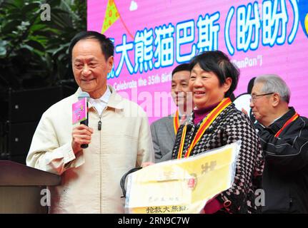 (151128) -- FUZHOU,2015 -- Li Xingyu (R, Front), a farmer who found suffering giant panda Basi in the wild and saved her from danger 31 years ago, is invited to attend Basi s 35th birthday party at the panda research and exchange center in Fuzhou, capital of southeast China s Fujian Province, Nov. 28, 2015. Basi, currently one of the oldest living panda in the world, turns 35 on Saturday, which roughly equals 130 years in human age. Basi in 1987 visited the U.S. San Diego Zoo for shows. She attracted around 2.5 million visitors during her six-month stay in the United States and amazed many vis Stock Photo