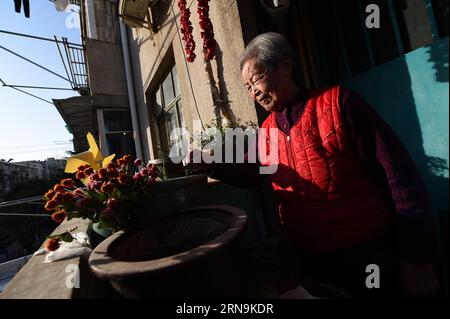 Ai Yiying, 87, survivor of the atrocious Nanjing Massacre, poses at home in Nanjing, capital of east China s Jiangsu Province, on Dec. 3, 2015. Ai Yiying survived in the Nanjing Massacre when she was 9 years old. She witnessed in a hideout that her father Ai Renyin, her uncles Ai Renbing and Ai Renlin, her cousin Ai Yisheng were forced away and killed by Japanese army. Some survivors of the Nanjing Massacre held family memorial rites for their lost relatives at the Memorial Hall of the Victims in the Nanjing Massacre by Japanese Invaders, ahead of the national memorial day for the atrocity. At Stock Photo