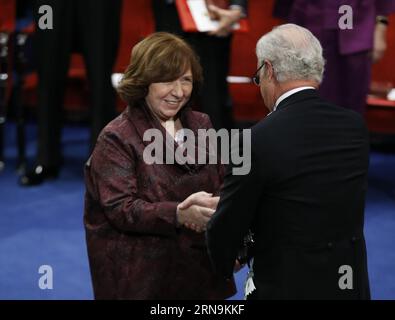 151210 -- STOCKHOLM, Dec. 10, 2015 -- 2015 s Nobel laureate in Literature Svetlana Alexievich L receives her prize from Sweden s King Carl XVI Gustaf during the Nobel Prize award ceremony at the Concert Hall in Stockholm, capital of Sweden, Dec. 10, 2015.  SWEDEN-NOBEL-PRIZE-AWARD-CEREMONY YexPingfan PUBLICATIONxNOTxINxCHN Stock Photo