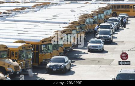 (151215) -- LOS ANGELES, Dec. 15, 2015 -- School buses are parked at Los Angeles Unified School District (LAUSD) Gardena garage in Los Angeles, the United States, Dec. 15, 2015. All LAUSD schools will stay closed today in response to a reported bomb threat, Schools Superintendent Ramon Cortines said. Police said the threat was called in to a School Board member. The threat is involving backpacks and packages left at campuses. The closures applied to all LAUSD campuses, around 900 of them. Los Angeles Unified School District is the second-largest school district in United States, which has more Stock Photo