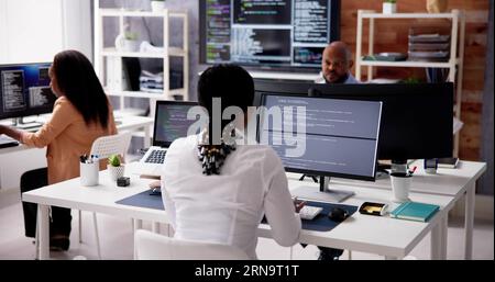 African Business Team Working On Computer. Software App Development Stock Photo