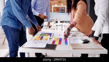 Designer Group At Desk Discussing Custom House Remodel Stock Photo - Alamy