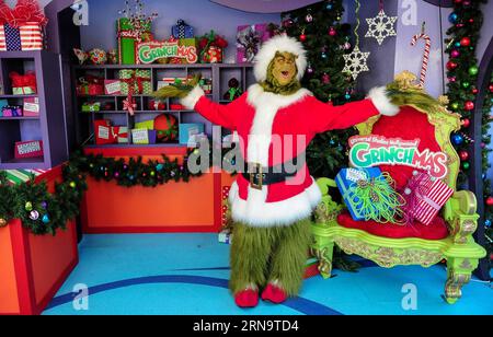 A figure of Crinch is displayed at the Universal Studios Hollywood theme park in Los Angels, California of the United States, on Dec. 18, 2015. The theme park started a Crinchmas celebration for upcoming Christmas and New Year from Dec. 18 to Jan. 3, 2016. The Grinch came from How the Grinch Stole Christmas which was written by famous American children s book writer Dr. Seuss and later made into a Universal movie with the same title in 2000. )(azp) US-HOLLYWOOD-GRINCHMAS ZHANGxCHAOQUN PUBLICATIONxNOTxINxCHN   a Figure of  IS displayed AT The Universal Studios Hollywood Theme Park in Los Angels Stock Photo