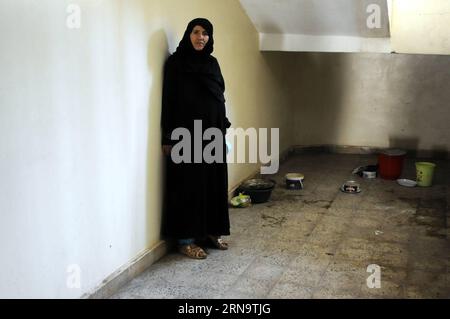 A Yemeni woman stands at a temporary evacuation center in Sanaa, capital of Yemen, Dec. 19, 2015, as her family was forced to flee from home due to the ongoing air strikes and internal conflicts. According to the United Nations High Commissioner for Refugees (UNHCR), there are 2.5 million internal displaced persons (IDPs) as a result of the nine-month civil war in Yemen. Hani Ali) YEMEN-SANAA-DISPLACED PEOPLE MohammedxMohammed PUBLICATIONxNOTxINxCHN   a Yemeni Woman stands AT a temporary Evacuation Center in Sanaa Capital of Yemen DEC 19 2015 As her Family what Forced to Flee from Home Due to Stock Photo