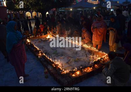 (151220) -- LAHORE, Dec. 19, 2015 -- Pakistani Muslim devotees light candles and oil lamps at the shrine of the Sufi saint Mian Mir Sahib during a festival to mark the saint s death anniversary in eastern Pakistan s Lahore, Dec. 19, 2015. Hundreds of devotees are attending the two-day festival. ) PAKISTAN-LAHORE-RELIGIOUS FESTIVAL JamilxAhmed PUBLICATIONxNOTxINxCHN   151220 Lahore DEC 19 2015 Pakistani Muslim devotees Light Candles and Oil lamps AT The Shrine of The Sufi Saint Mian me Sahib during a Festival to Mark The Saint S Death Anniversary in Eastern Pakistan S Lahore DEC 19 2015 hundred Stock Photo