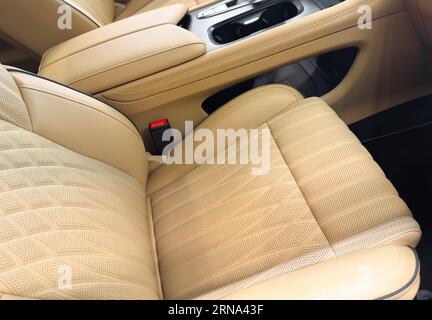 https://l450v.alamy.com/450v/2rna43f/modern-luxury-car-brown-leather-interior-part-of-orange-leather-car-seat-details-with-white-stitching-interior-of-prestige-car-comfortable-perforat-2rna43f.jpg