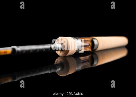 Fishing rod spinning with the line close-up. Fishing rod and reel isolated  on white background. Fishing rod rings. Fishing tackle. Fishing spinning re  Stock Photo - Alamy