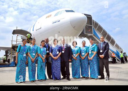(160107) -- COLOMBO, Jan. 7, 2016 -- Staff members pose for a photo with the last Airbus A340 aircraft at Bandaranaike International Airport in Katunayake near Colombo, capital of Sri Lanka, Jan. 7, 2016. SriLankan Airlines, Sri Lanka s national airline carrier, bid goodbye to the last of its Airbus A340 aircrafts on Thursday after more than two decades in service. SriLankan Airlines was the first Asian airline to operate the four-engine A340 aircraft which has carried many foreign dignitaries. The national carrier has inducted a new fleet of seven sophisticated A330-300 aircrafts with higher Stock Photo