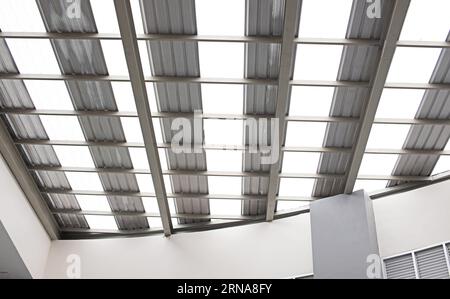 Details of the steel structure supporting the glass roof in the building Stock Photo