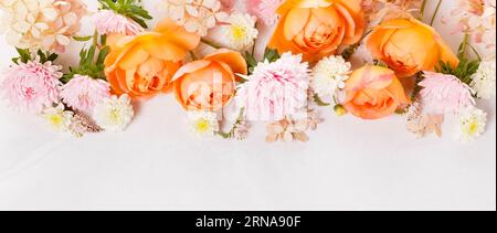 Autumn creative composition roses, hydrangea flowers on gray background. Fall, autumn background. Stock Photo