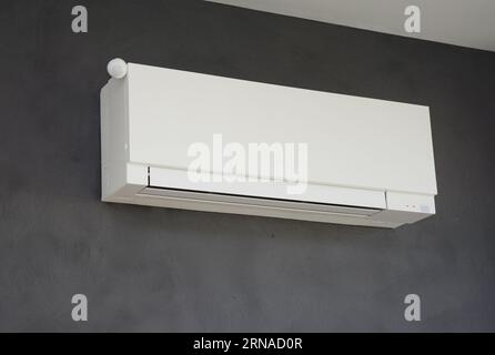 Modern Wall-Mounted Air Conditioner Unit in Minimalist Interior Setting ...