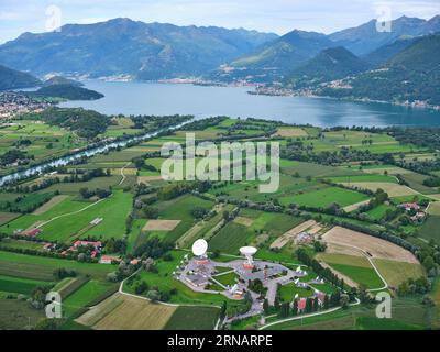 AERIAL VIEW. Lario Space Centre with Lake Como in the distancer. Gera Lario, Province of Como, Lombardy, Italy. Stock Photo