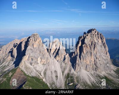 AERIAL VIEW. Sassolungo Group with its highest peak, the 3181-meter-high Sassolungo (in Italian) or Langkofel (in German). Dolomites, Italy. Stock Photo