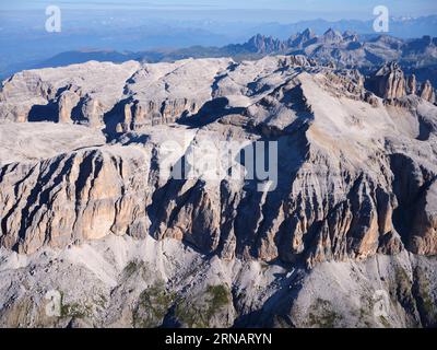 AERIAL VIEW. Venetian side of Sella Massif with 3152-meter-high Piz Boè (foreground, right). Province of Belluno, Veneto, Italy. Stock Photo