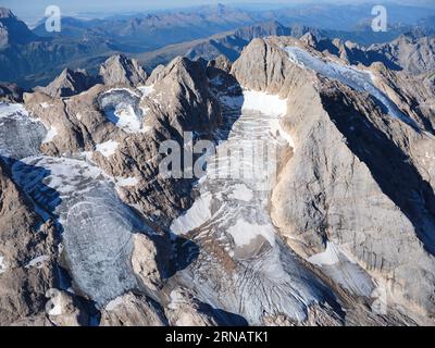 AERIAL VIEW. North-facing side of Marmolada (3343m) and the only glaciers in the Dolomites. Trentino-Alto Adige (southern side is in Veneto), Italy. Stock Photo