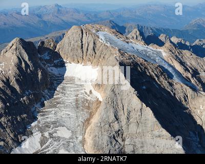 AERIAL VIEW. North-facing side of Marmolada (3343m) and the only glaciers in the Dolomites. Trentino-Alto Adige (southern side is in Veneto), Italy. Stock Photo