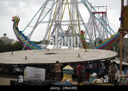 Rajkot, Gujarat, India 30-08-2023, Workers are forming circle ride for Saurashtra's biggest fair Stock Photo