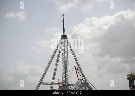 Rajkot, Gujarat, India 30-08-2023, Workers are making chakdol for Saurashtra's biggest fair. Stock Photo