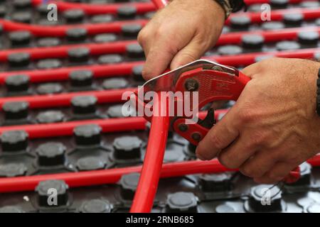 Water underfloor heating systems installation, work in progress on construction site for a flat residence building Stock Photo