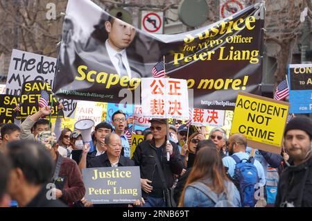 People take part in a rally in support of New York City police officer Peter Liang, in San Francisco, the United States, Feb. 20, 2016. Tens of thousands of people rallied Saturday in more than 30 American cities to protest the conviction of Peter Liang, a former New York police officer of Chinese descent. A ricocheted bullet from Liang s service weapon accidentally killed African American Akai Gurley, an unarmed civilian, when the former New York police officer was patrolling in a housing project in the borough of Brooklyn in late November in 2014. Liang was found guilty of the killing of Gur Stock Photo