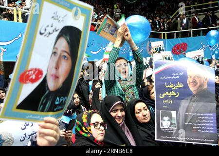 Iranian women hold up posters during a reformists campaign meeting in Tehran, capital of Iran, on Feb. 20, 2016. Iranian hopefuls began their campaigns on Thursday in a run for two important Majlis (parliament) and Assembly of Experts elections slated for Feb. 26. ) IRAN-TEHRAN-ELECTION-REFORMISTS-CAMPAIGN RALLY AhmadxHalabisaz PUBLICATIONxNOTxINxCHN   Iranian Women Hold up Posters during a Reformists Campaign Meeting in TEHRAN Capital of Iran ON Feb 20 2016 Iranian hopeful began their Campaigns ON Thursday in a Run for Two IMPORTANT Majlis Parliament and Assembly of Experts Elections slated f Stock Photo